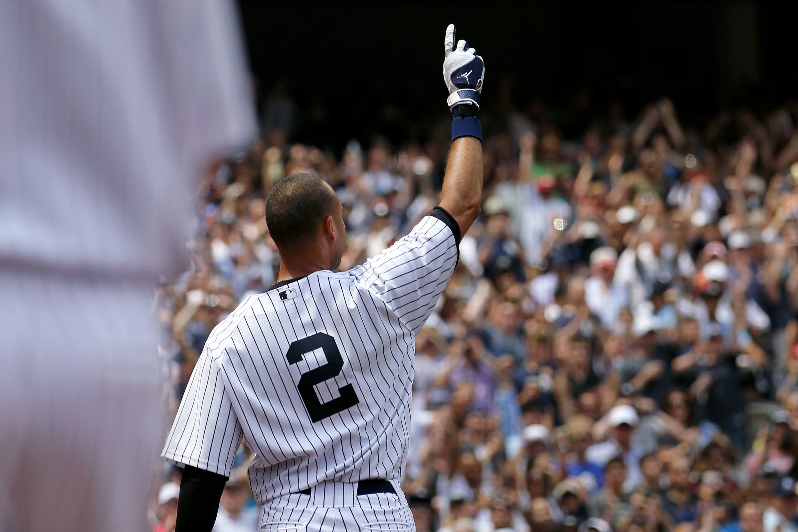 NEW YORK, NY - JULY 09:  Derek Jeter #2 of the New York Yankees waves to the fans after hitting a solo home run in the third inning for career hit 3000 while playing against the Tampa Bay Rays at Yankee Stadium on July 9, 2011 in the Bronx borough of New York City.  (Photo by Nick Laham/Getty Images)