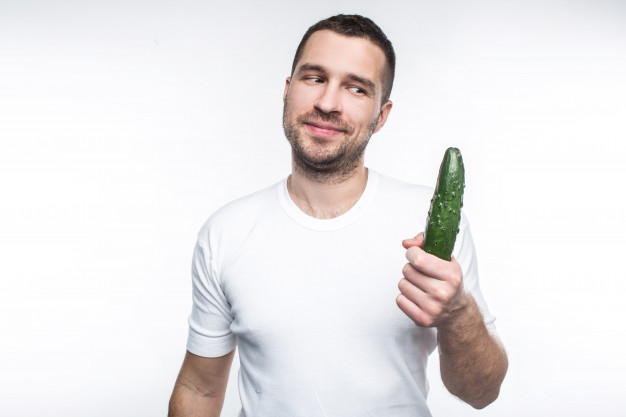 cheerful-happy-guy-is-holding-big-long-cucumber-he-likes-eat-organic-natural-food-this-man-is-vegan-raw-food-is-his-favourite-one-isolated-white_152404-373