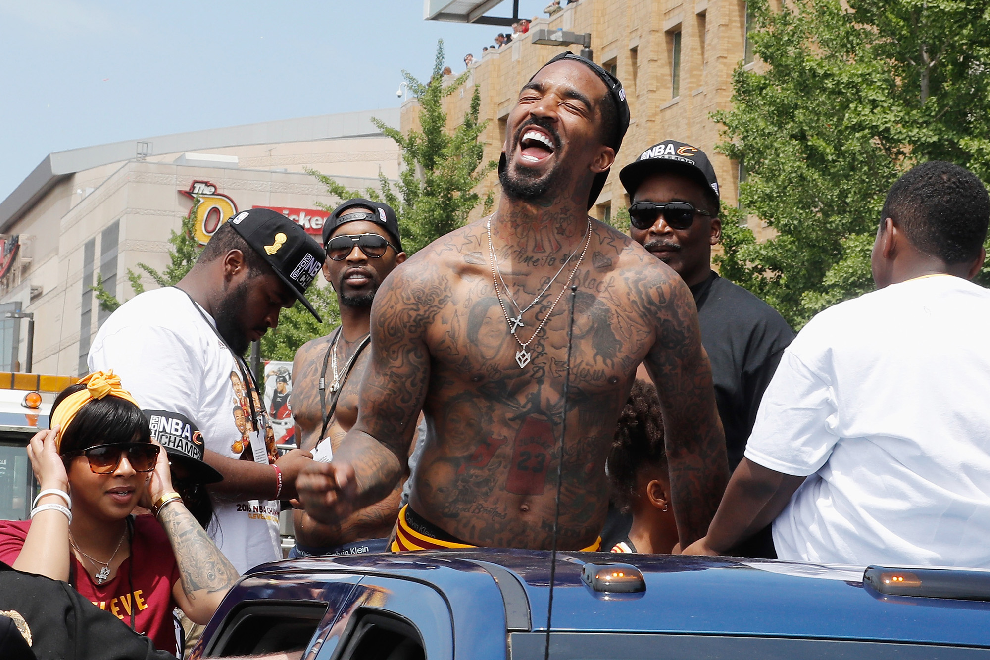 CLEVELAND, OH - JUNE 22:  J.R. Smith #5 of the Cleveland Cavaliers waves at fans during the Cleveland Cavaliers Victory Parade And Rally on June 22, 2016 in downtown Cleveland, Ohio.  NOTE TO USER: User expressly acknowledges and agrees that, by downloading and/or using this Photograph, user is consenting to the terms and conditions of the Getty Images License Agreement. Mandatory Copyright Notice: Copyright 2016 NBAE  (Photo by Gregory Shamus/NBAE/Getty Images)
