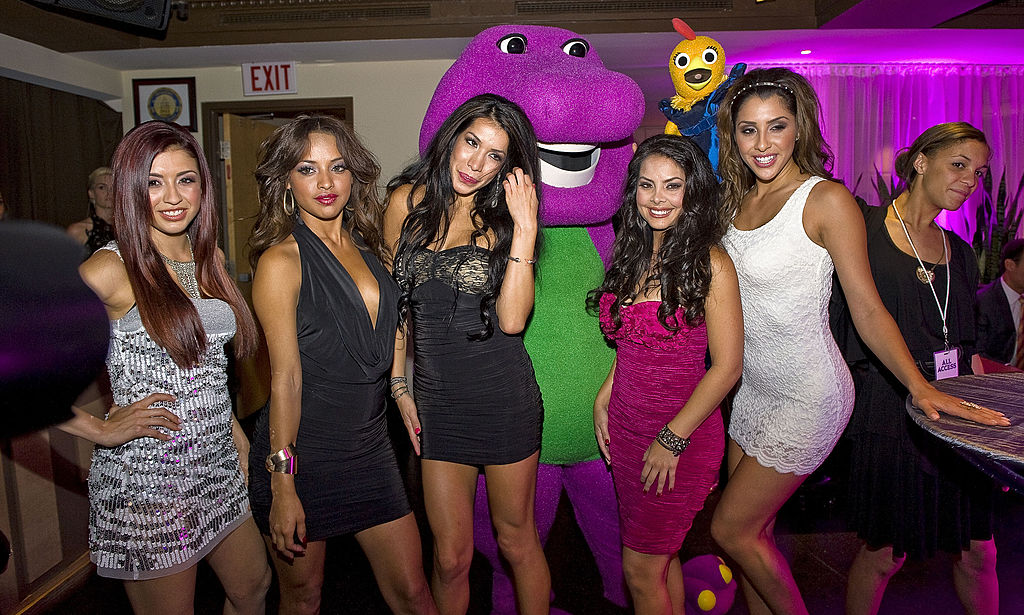 "Beauties and the Boss" cast members Karina Chapa, Jennifer Martinez, Diane Gonzalez, Monica Weitzel and Jennifer Christine Carrillo pose with Barney the Purple Dinosaur and Chica at the NBC Universal VIP party during the Cable Show 2011 at Privet Nightclub and Lounge on June 15, 2011 in Chicago, Illinois. (Photo by Lyle A. Waisman/FilmMagic)