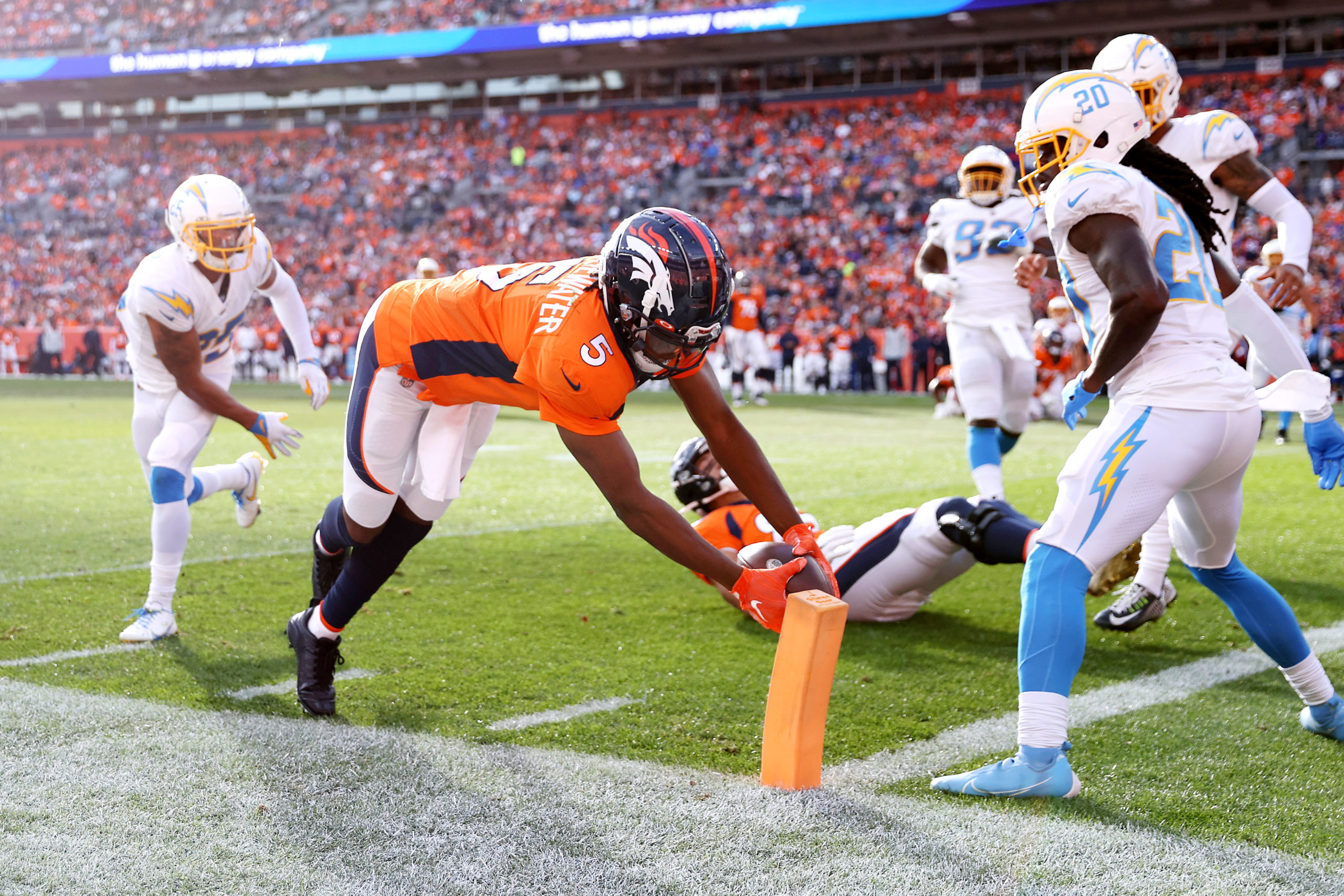 DENVER, COLORADO - NOVEMBER 28: Teddy Bridgewater #5 of the Denver Broncos dives for a touchdown in the first quarter of the game against the Los Angeles Chargers at Empower Field At Mile High on November 28, 2021 in Denver, Colorado. (Photo by Matthew Stockman/Getty Images)