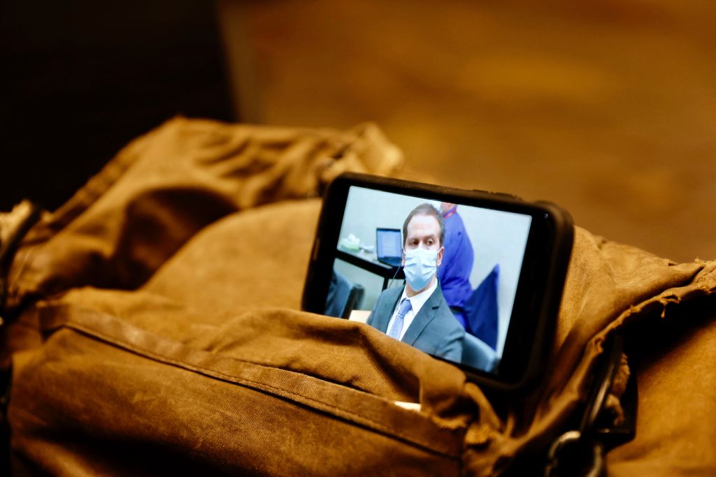 A journalist watches their mobile phone showing Derek Chauvin as the verdict in his trial over the death of George Floyd is announced in Minneapolis, Minnesota on April 20, 2021. - Sacked police officer Derek Chauvin was convicted of murder and manslaughter on april 20 in the death of African-American George Floyd in a case that roiled the United States for almost a year, laying bare deep racial divisions. (Photo by Kerem YUCEL / AFP) (Photo by KEREM YUCEL/AFP via Getty Images)