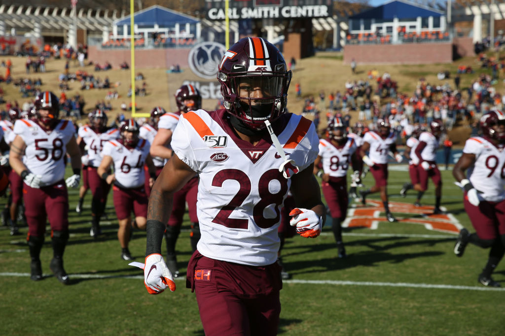 CHARLOTTESVILLE, VA - NOVEMBER 29: Jermaine Waller #28 of the Virginia Tech Hokies runs off the field before the start of a game against the Virginia Cavaliers at Scott Stadium on November 29, 2019 in Charlottesville, Virginia. (Photo by Ryan M. Kelly/Getty Images)