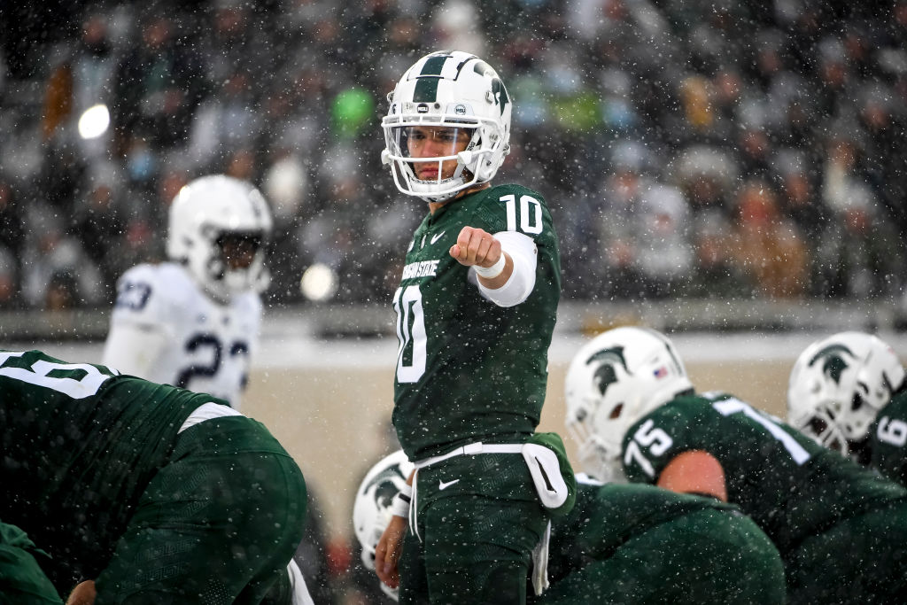 EAST LANSING, MICHIGAN - NOVEMBER 27: Payton Thorne #10 of the Michigan State Spartans signals to his team against the Penn State Nittany Lions at Spartan Stadium on November 27, 2021 in East Lansing, Michigan. (Photo by Nic Antaya/Getty Images)