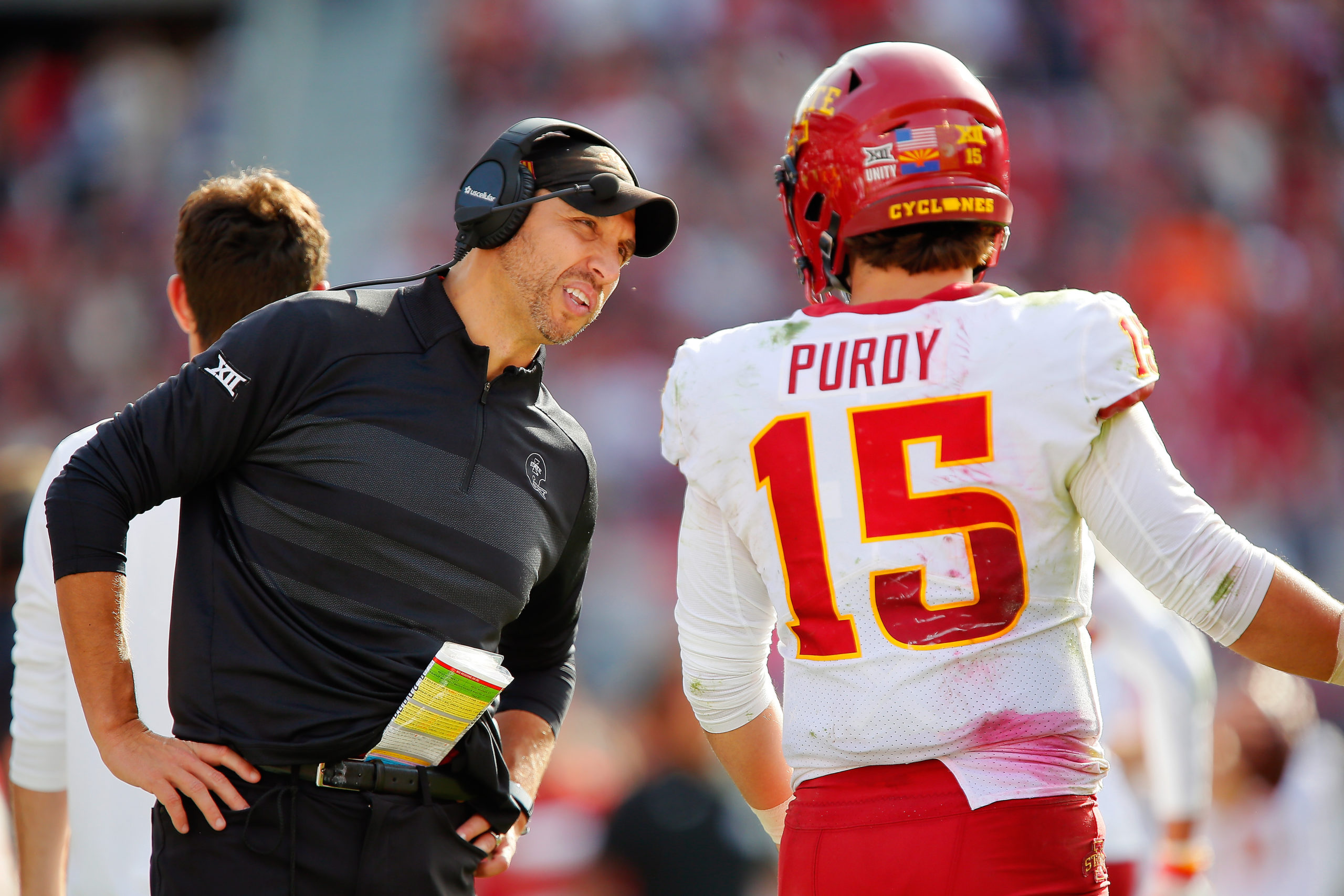 NORMAN, OK - NOVEMBER 20:  Head coach Matt Campbell talks to quarterback Brock Purdy #15 of the Iowa State Cyclones during a break in play against the Oklahoma Sooners in the fourth quarter at Gaylord Family Oklahoma Memorial Stadium on November 20, 2021 in Norman, Oklahoma.  The Sooners won 28-21.  (Photo by Brian Bahr/Getty Images)