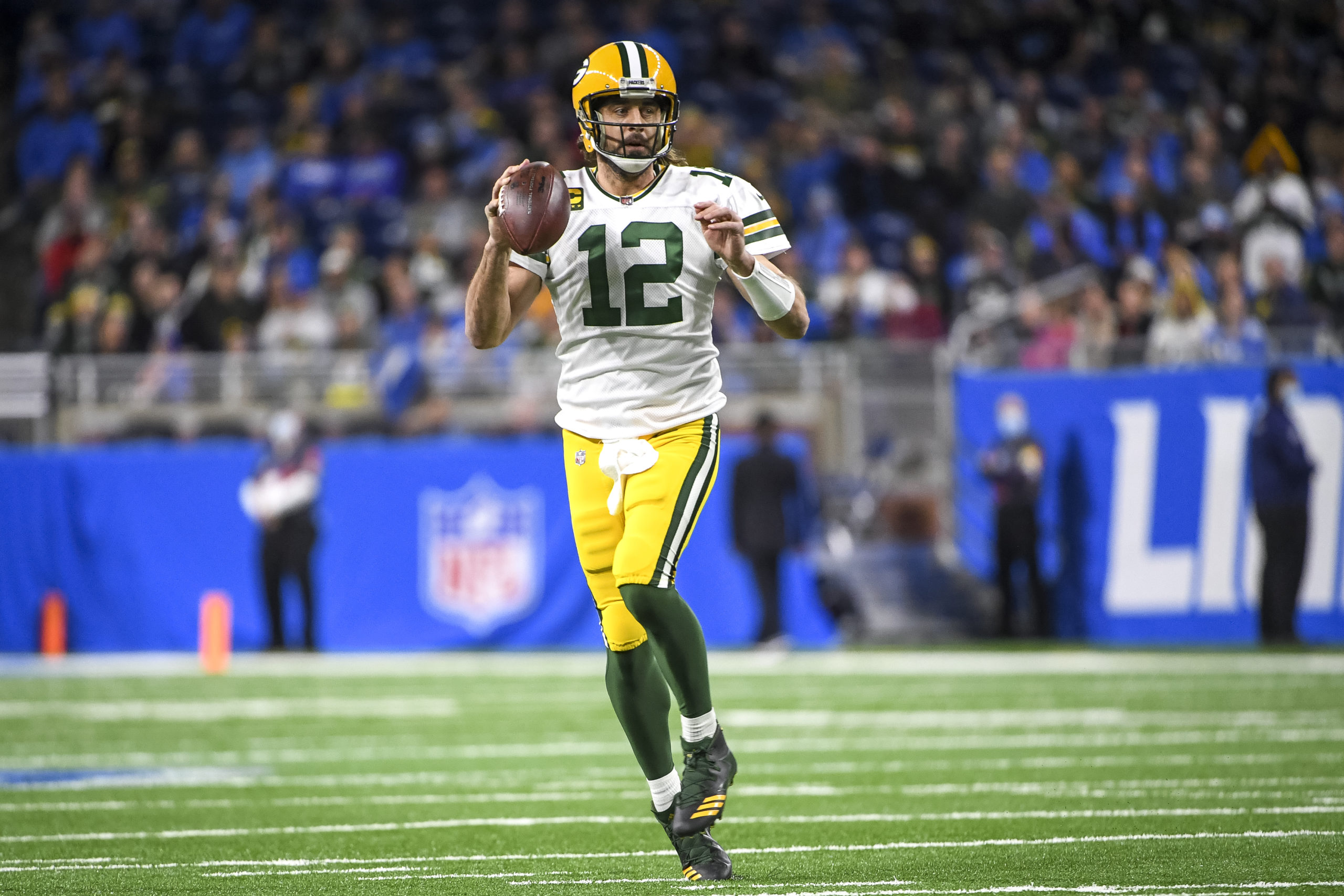 DETROIT, MICHIGAN - JANUARY 09: Aaron Rodgers #12 of the Green Bay Packers looks to pass against the Detroit Lions at Ford Field on January 09, 2022 in Detroit, Michigan. (Photo by Nic Antaya/Getty Images)