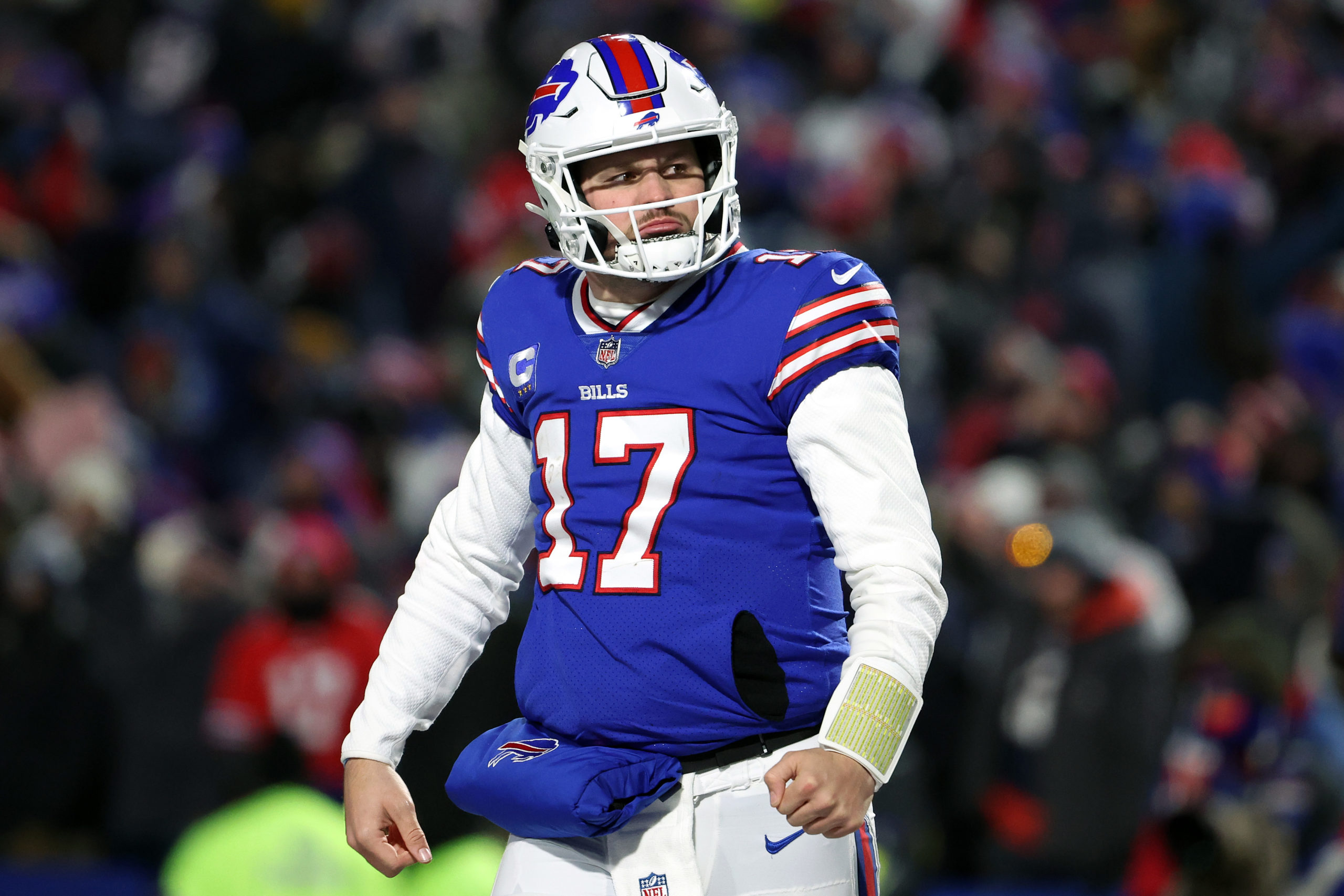 BUFFALO, NEW YORK - JANUARY 15: Josh Allen #17 of the Buffalo Bills celebrates after throwing a touchdown pass against the New England Patriots during the third quarter in the AFC Wild Card playoff game at Highmark Stadium on January 15, 2022 in Buffalo, New York. (Photo by Timothy T Ludwig/Getty Images)