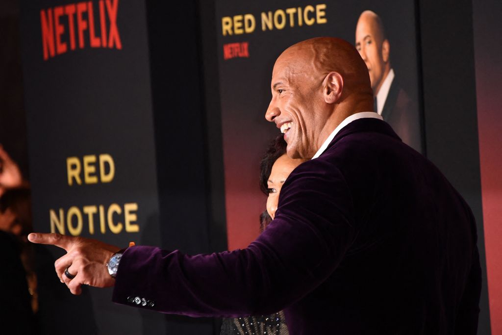 US actor Dwayne Johnson attends the world premiere of Netflix's "Red Notice" at LA Live in Los Angeles on November 3, 2021. (Photo by Patrick T. FALLON / AFP) (Photo by PATRICK T. FALLON/AFP via Getty Images)