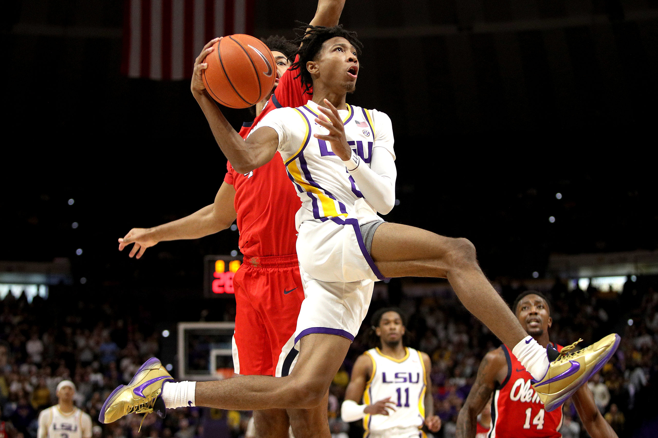 BATON ROUGE, LOUISIANA - FEBRUARY 01: Eric Gaines #2 of the LSU Tigers drives to the basket past Jaemyn Brakefield #4 of the Mississippi Rebels during the second half at Pete Maravich Assembly Center on February 01, 2022 in Baton Rouge, Louisiana. (Photo by Sean Gardner/Getty Images)