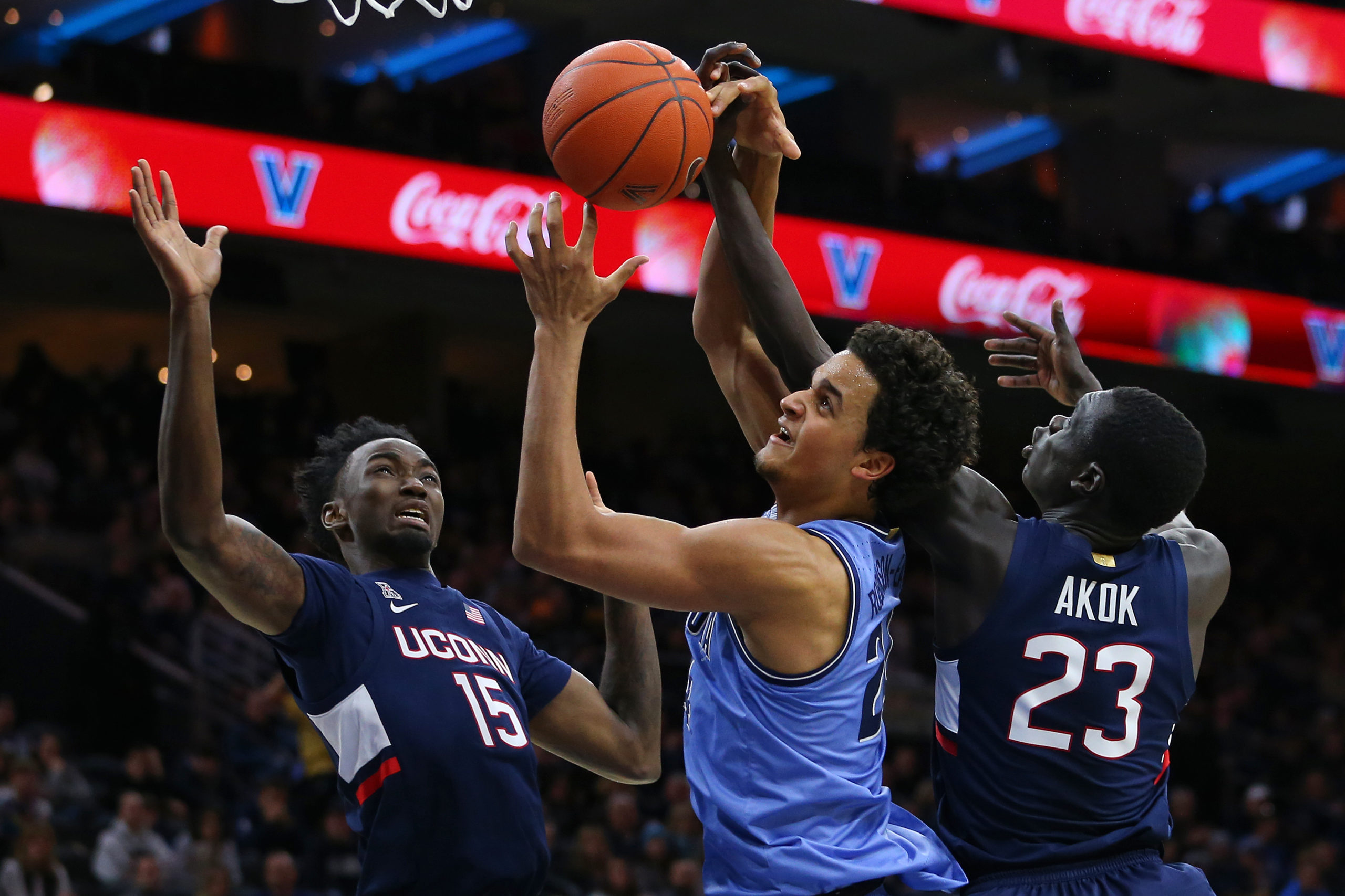 PHILADELPHIA, PA - JANUARY 18: Jermaine Samuels #23 of the Villanova Wildcats in action against Sidney Wilson #15 and Akok Akok #23 of the Connecticut Huskies during a college basketball game at Wells Fargo Center on January 18, 2020 in Philadelphia, Pennsylvania. (Photo by Rich Schultz/Getty Images)