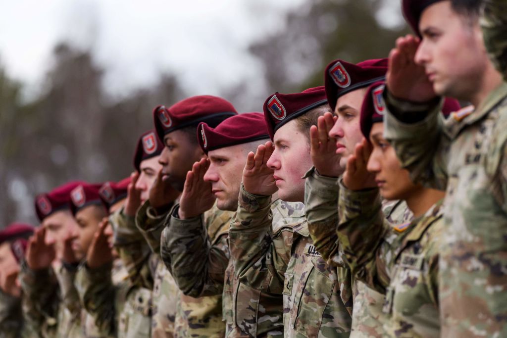 A batallion of US airborne soldiers stand to attention at the Adazi Military Base of the Latvian armed forces in Adazi, Latvia on February 25, 2022, upon arrival for their mission to strengthen the NATO enhanced Forward Presence (eFP) multinational battlegroup in the wake of Russia's military aggression of Ukraine. (Photo by Gints Ivuskans / AFP) (Photo by GINTS IVUSKANS/AFP via Getty Images)