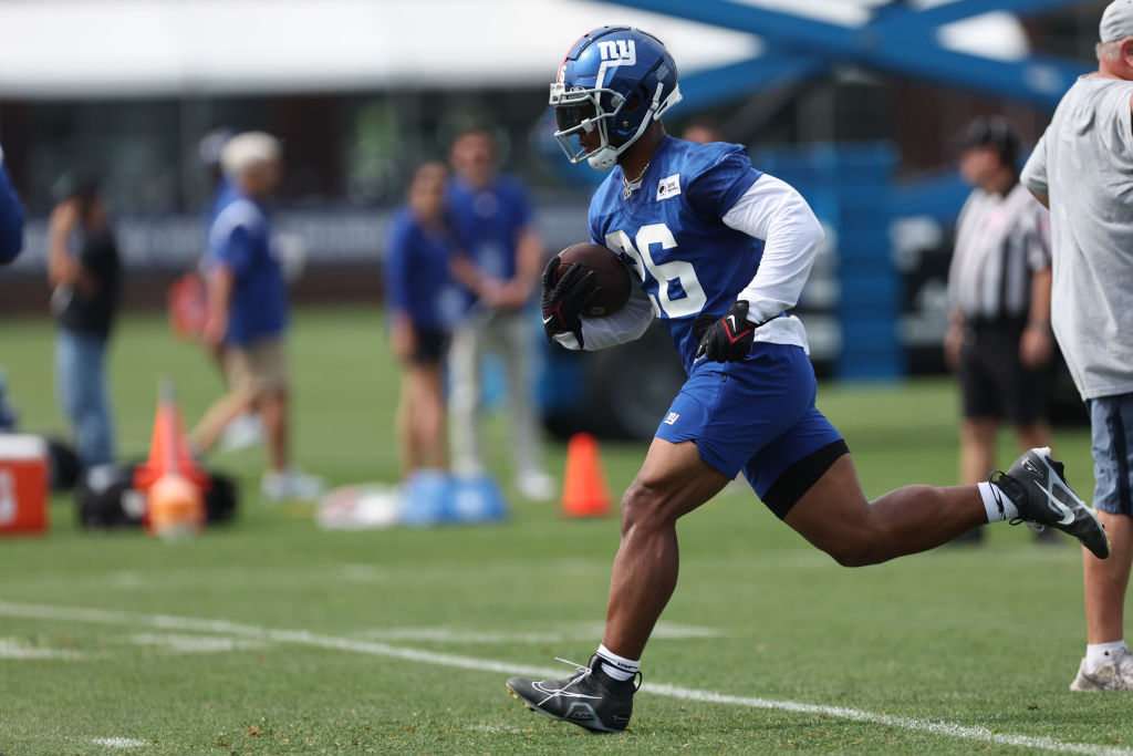 EAST RUTHERFORD, NJ - JULY 28: Running back Saquon Barkley #26 of the New York Giants runs during training camp at Quest Diagnostics Training Center on July 28, 2022 in East Rutherford, New Jersey. (Photo by Rich Schultz/Getty Images)