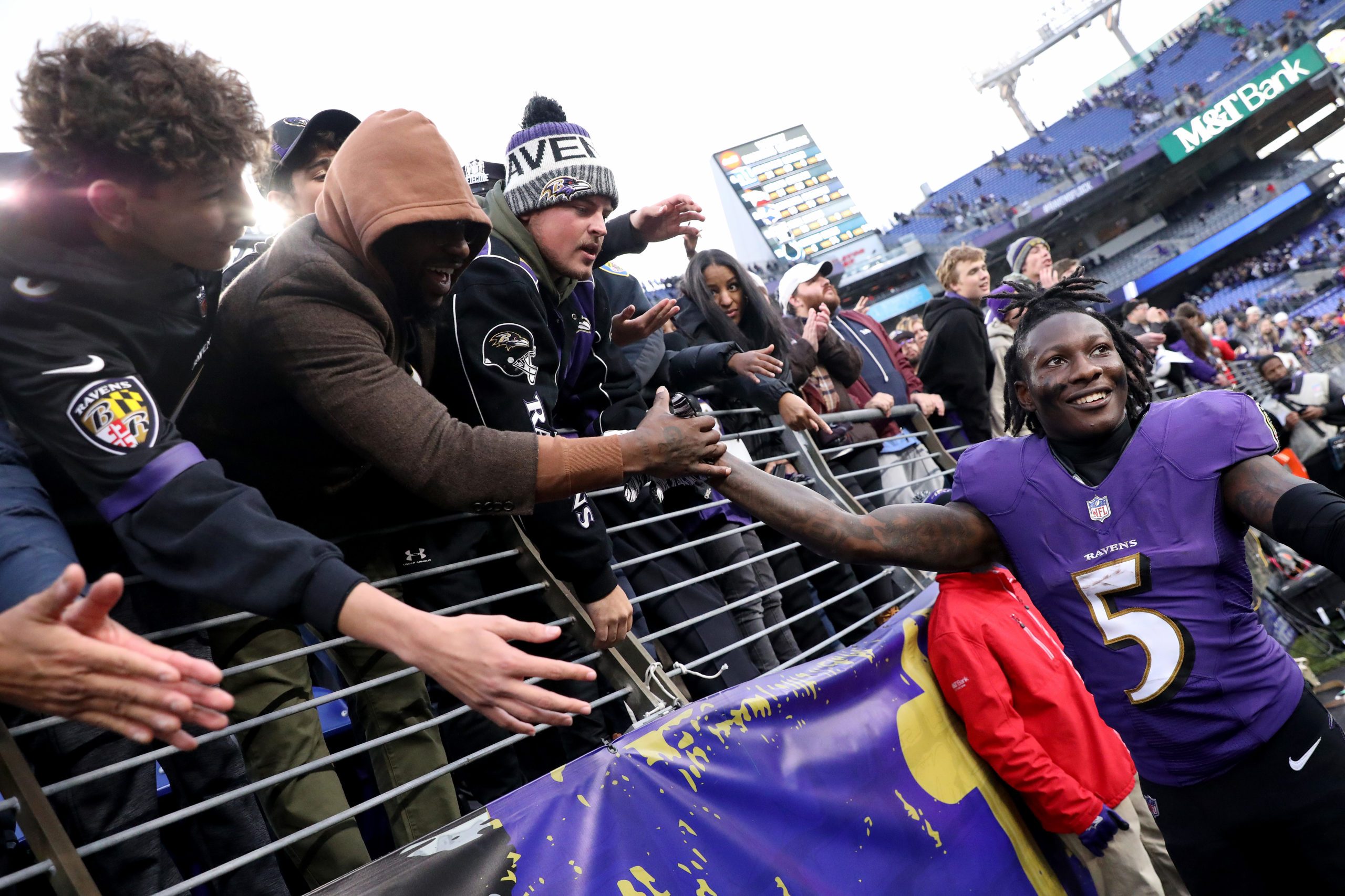 BALTIMORE, MARYLAND - NOVEMBER 07: Marquise Brown #5 of the Baltimore Ravens high fives with fans after their overtime win against the Minnesota Vikings at M&T Bank Stadium on November 07, 2021 in Baltimore, Maryland. (Photo by Todd Olszewski/Getty Images)