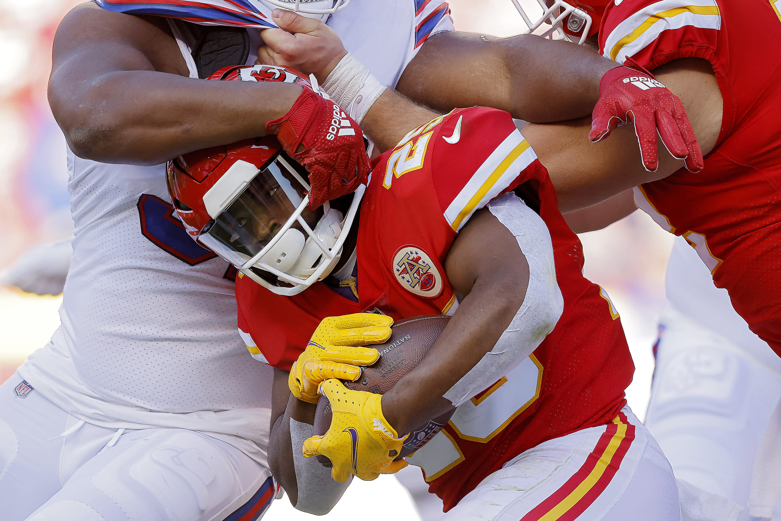 KANSAS CITY, MISSOURI - OCTOBER 16: Clyde Edwards-Helaire #25 of the Kansas City Chiefs is tackled during the second quarter against the Buffalo Bills at Arrowhead Stadium on October 16, 2022 in Kansas City, Missouri. (Photo by David Eulitt/Getty Images)