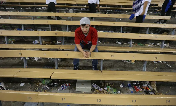 LOS ANGELES, CA - OCTOBER 27: A dejected Red Sox fan Hugo Chavez of New Mexico after the game. The Dodgers defeated the Red Sox 3-2. Los Angeles Dodgers hosted the Boston Red Sox in Game 3 of the World Series at Dodger Stadium in Los Angeles on Oct. 27, 2018. (Photo by Stan Grossfeld/The Boston Globe via Getty Images)