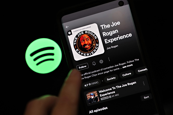 NEW YORK, NEW YORK - JANUARY 31: In this photo illustration, "The Joe Rogan Experience" podcast is viewed on Spotify's mobile app on January 31, 2022 in New York City. Several artists recently removed their music from Spotify in protest of hosting Joe Rogan's podcast. (Photo Illustration by Cindy Ord/Getty Images)