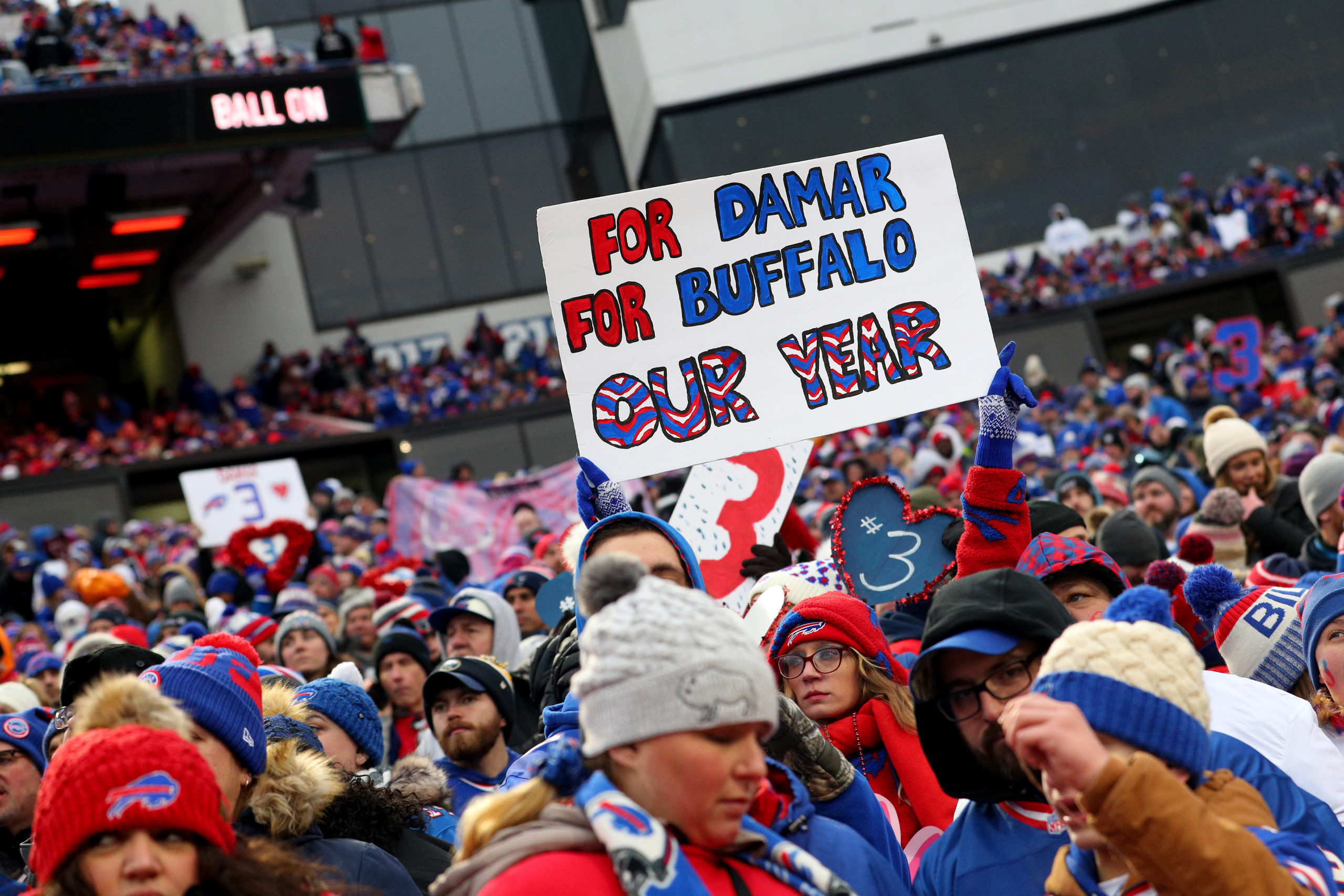 ORCHARD PARK, NEW YORK - JANUARY 08: Fans hold up a sign honoring Damar Hamlin #3 of the Buffalo Bills during the fourth quarter of a game between the Buffalo Bills and the New England Patriots at Highmark Stadium on January 08, 2023 in Orchard Park, New York. (Photo by Bryan Bennett/Getty Images)