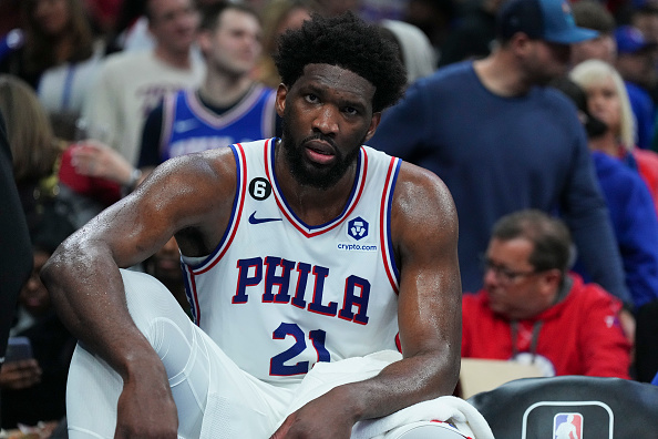 PHILADELPHIA, PA - JANUARY 28: Joel Embiid #21 of the Philadelphia 76ers looks on from the bench against the Denver Nuggets at the Wells Fargo Center on January 28, 2023 in Philadelphia, Pennsylvania. NOTE TO USER: User expressly acknowledges and agrees that, by downloading and or using this photograph, User is consenting to the terms and conditions of the Getty Images License Agreement. (Photo by Mitchell Leff/Getty Images)