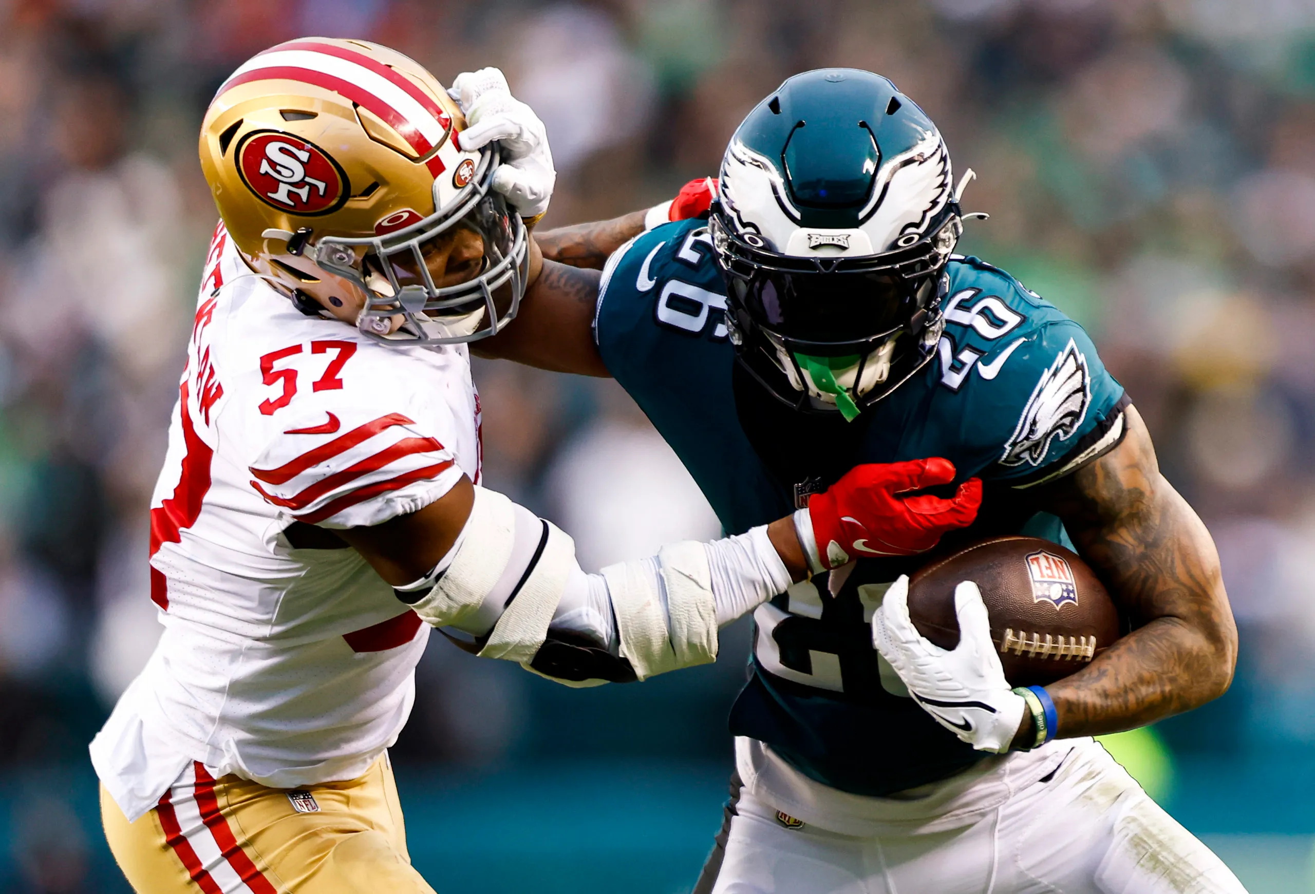 PHILADELPHIA, PA - JANUARY 29: Miles Sanders #26 of the Philadelphia Eagles stiff arms Dre Greenlaw #57 of the San Francisco 49ers while carrying the ball during the second quarter of the NFC Championship NFL football game at Lincoln Financial Field on January 29, 2023 in Philadelphia, Pennsylvania. (Photo by Kevin Sabitus/Getty Images) (Photo by Kevin Sabitus/Getty Images)