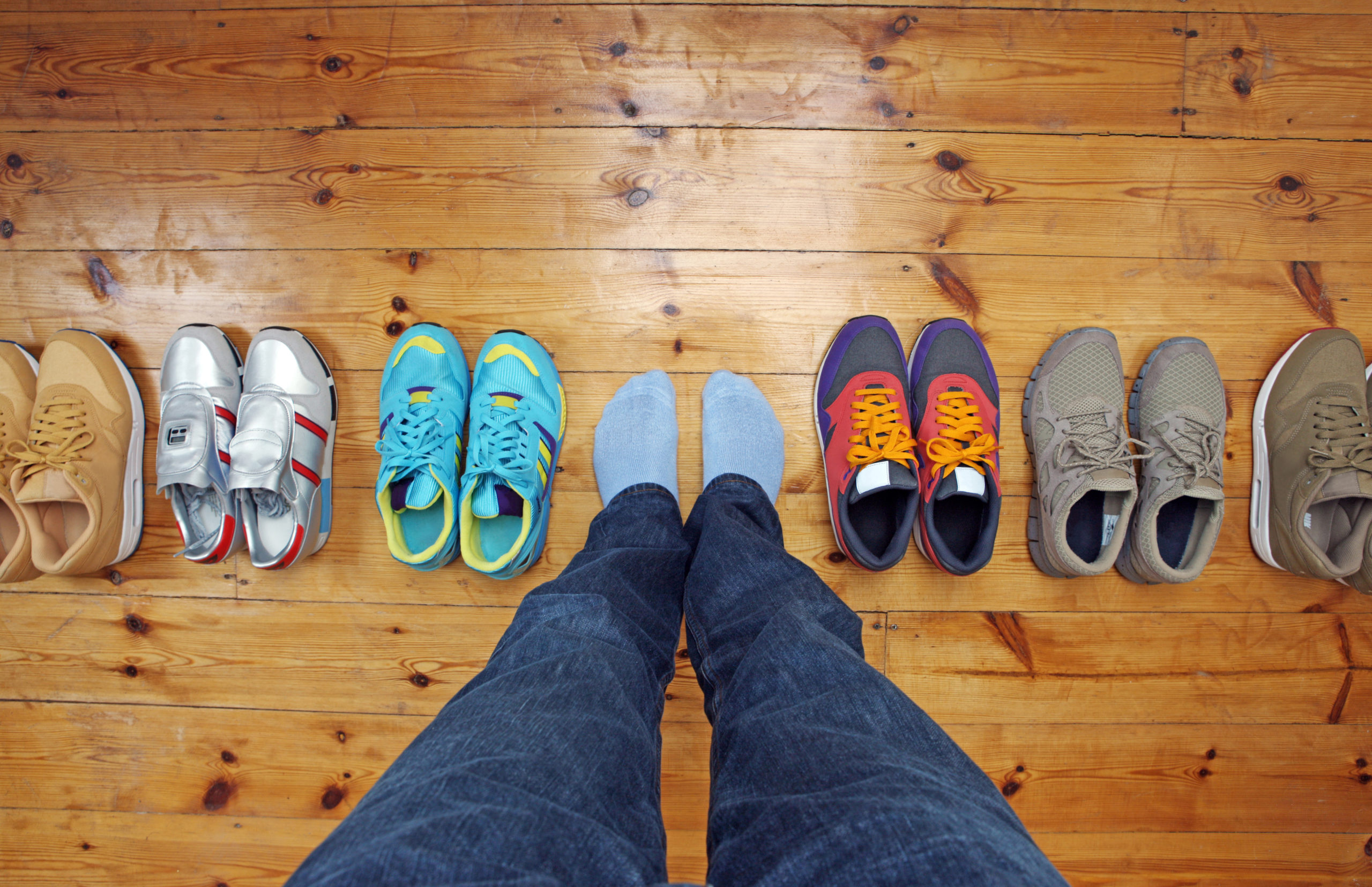 Deciding on what footwear to put on from choice of trainers.