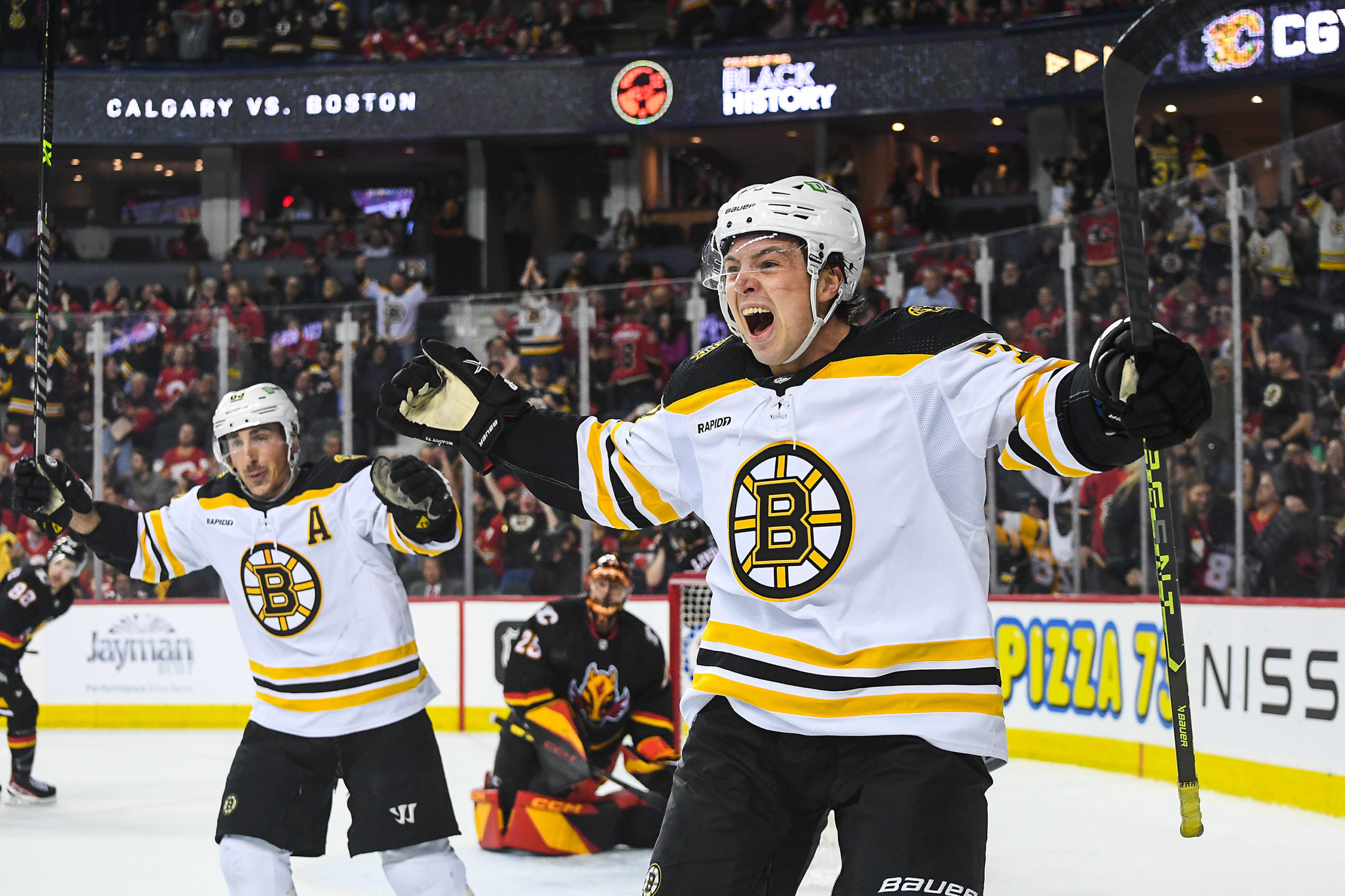 CALGARY, CANADA - FEBRUARY 28: Charlie McAvoy #73 of the Boston Bruins celebrates after scoring the game-winning goal against the Calgary Flames during the overtime period of an NHL game at Scotiabank Saddledome on February 28, 2023 in Calgary, Alberta, Canada. (Photo by Derek Leung/Getty Images)