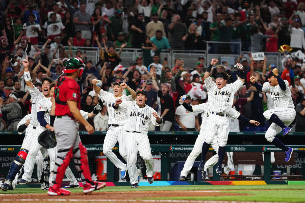 MIAMI, FL - MARCH 20:  Members of Team Japan celebrate in the ninth inning during the 2023 World Baseball Classic Semifinal game between Team Mexico and Team Japan at loanDepot Park on Monday, March 20, 2023 in Miami, Florida. (Photo by Mary DeCicco/WBCI/MLB Photos via Getty Images)