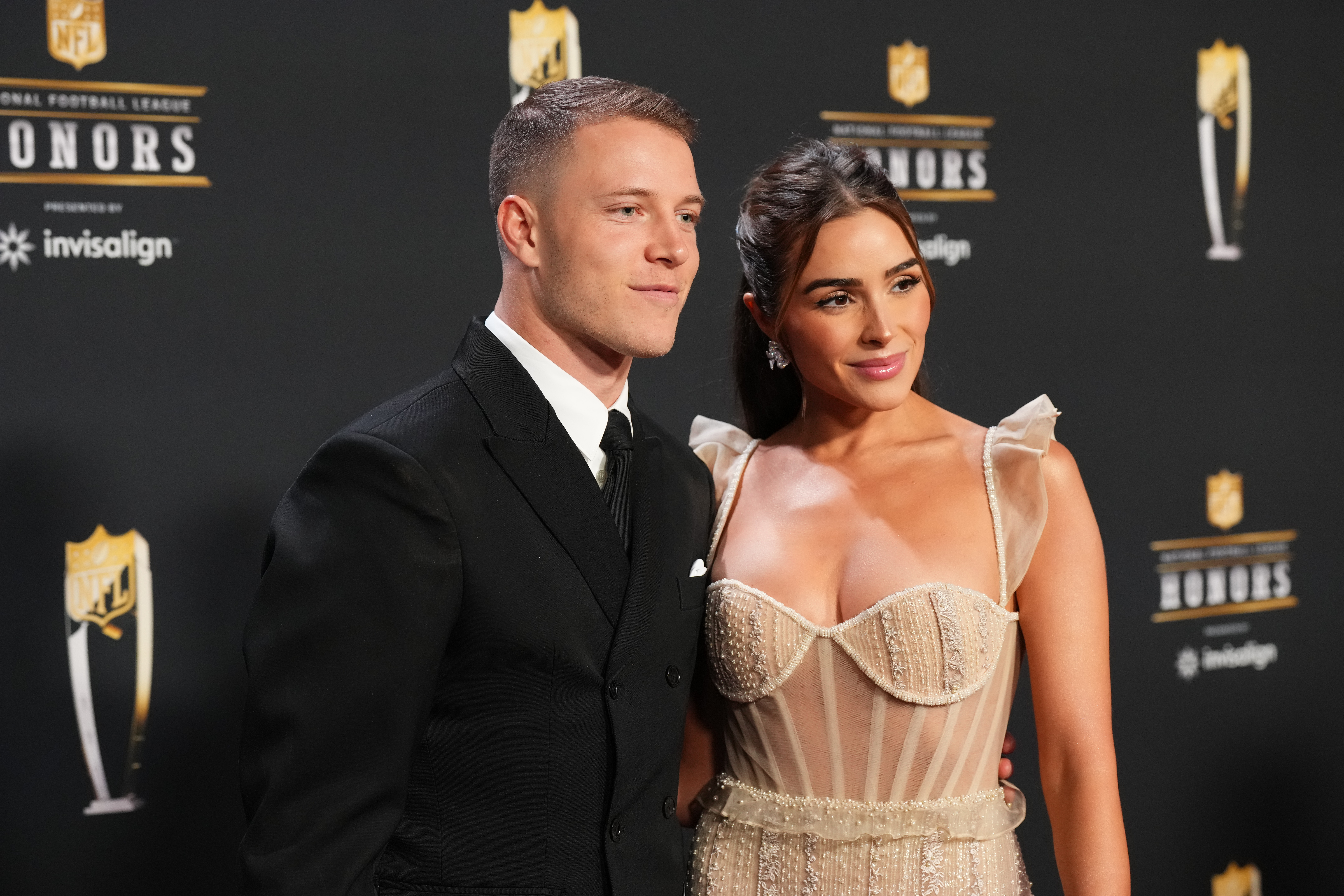 PHOENIX, AZ - FEBRUARY 09: Christian McCaffrey and Olivia Culpo pose for a photo on the red carpet during NFL Honors at the Symphony Hall on February 9, 2023 in Phoenix, Arizona. (Photo by Cooper Neill/Getty Images)