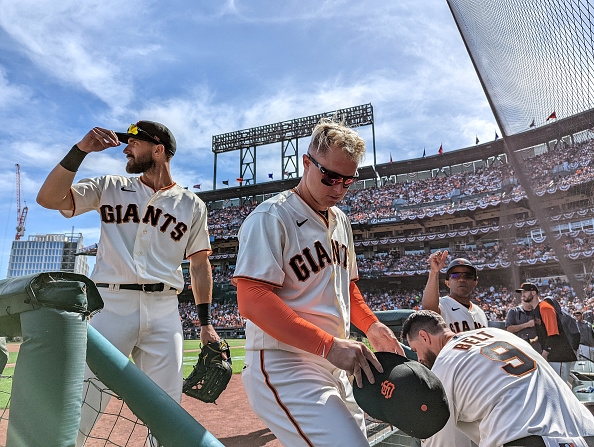SAN FRANCISCO, CALIFORNIA - APRIL 08: Steven Duggar #6 (left) and Joc Pederson #23 of the San Francisco Giants walk into the dugout in between innings of their opening day game against the Miami Marlins at Oracle Park on April 08, 2022 in San Francisco, California. (Photo by Ezra Shaw/Getty Images)
