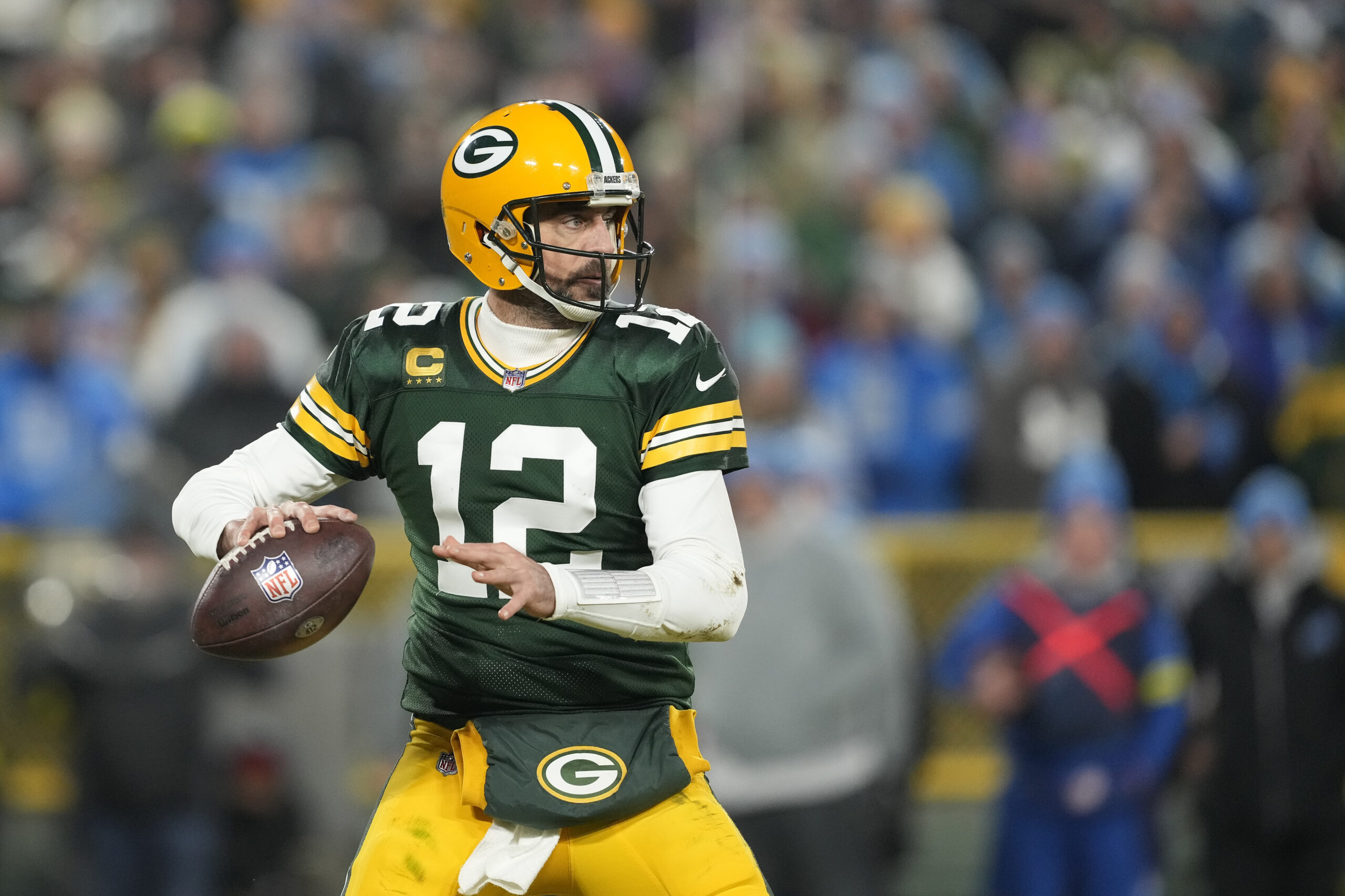 GREEN BAY, WISCONSIN - JANUARY 08: Aaron Rodgers #12 of the Green Bay Packers looks to the throw the pass against the Detroit Lions in the second half at Lambeau Field on January 08, 2023 in Green Bay, Wisconsin. (Photo by Patrick McDermott/Getty Images)