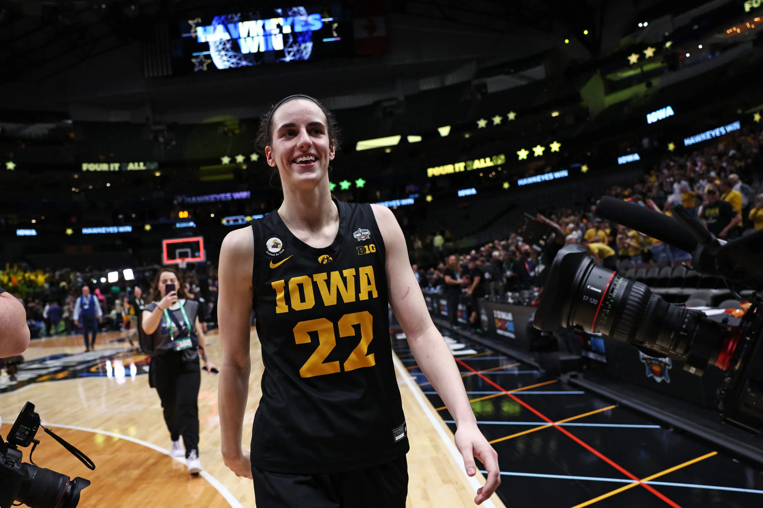DALLAS, TEXAS - MARCH 31: Caitlin Clark #22 of the Iowa Hawkeyes celebrates after the Iowa Hawkeyes beat the South Carolina Gamecocks 77-73 during the 2023 NCAA Women's Basketball Tournament Final Four semifinal game at American Airlines Center on March 31, 2023 in Dallas, Texas. (Photo by Tom Pennington/Getty Images)
