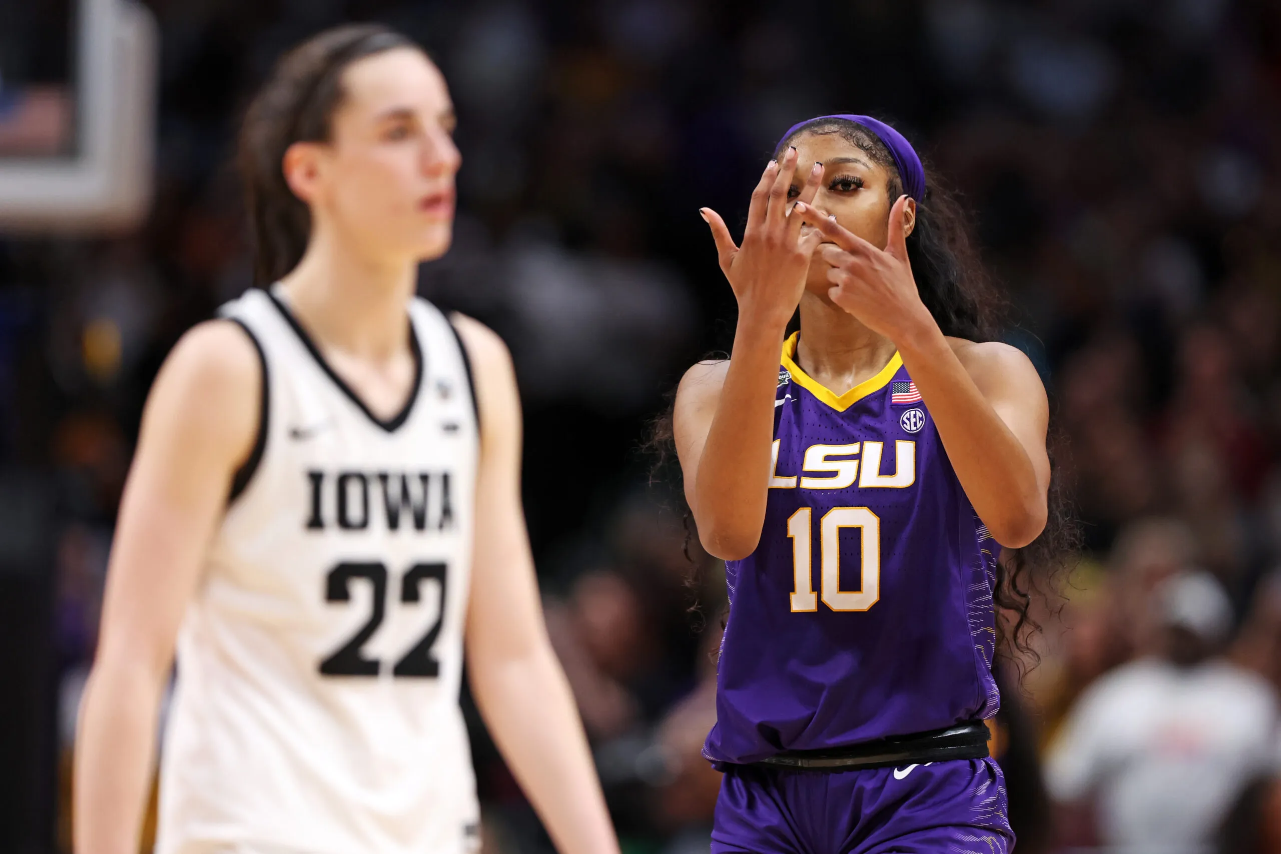 DALLAS, TEXAS - APRIL 02: Angel Reese #10 of the LSU Lady Tigers reacts towards Caitlin Clark #22 of the Iowa Hawkeyes during the fourth quarter during the 2023 NCAA Women's Basketball Tournament championship game at American Airlines Center on April 02, 2023 in Dallas, Texas. (Photo by Maddie Meyer/Getty Images)