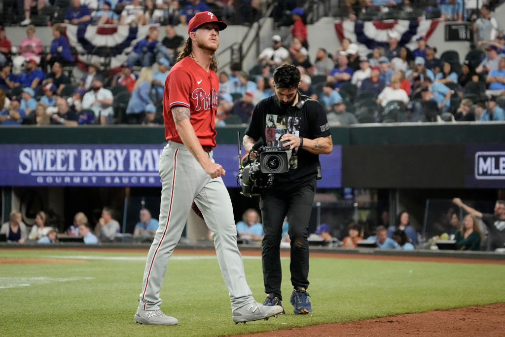 ARLINGTON, TEXAS - APRIL 02:  Starting pitcher Bailey Falter #70 of the Philadelphia Phillies walks back to the dugout after being removed from the game in the sixth inning against the Texas Rangers at Globe Life Field on April 02, 2023 in Arlington, Texas. (Photo by Sam Hodde/Getty Images)