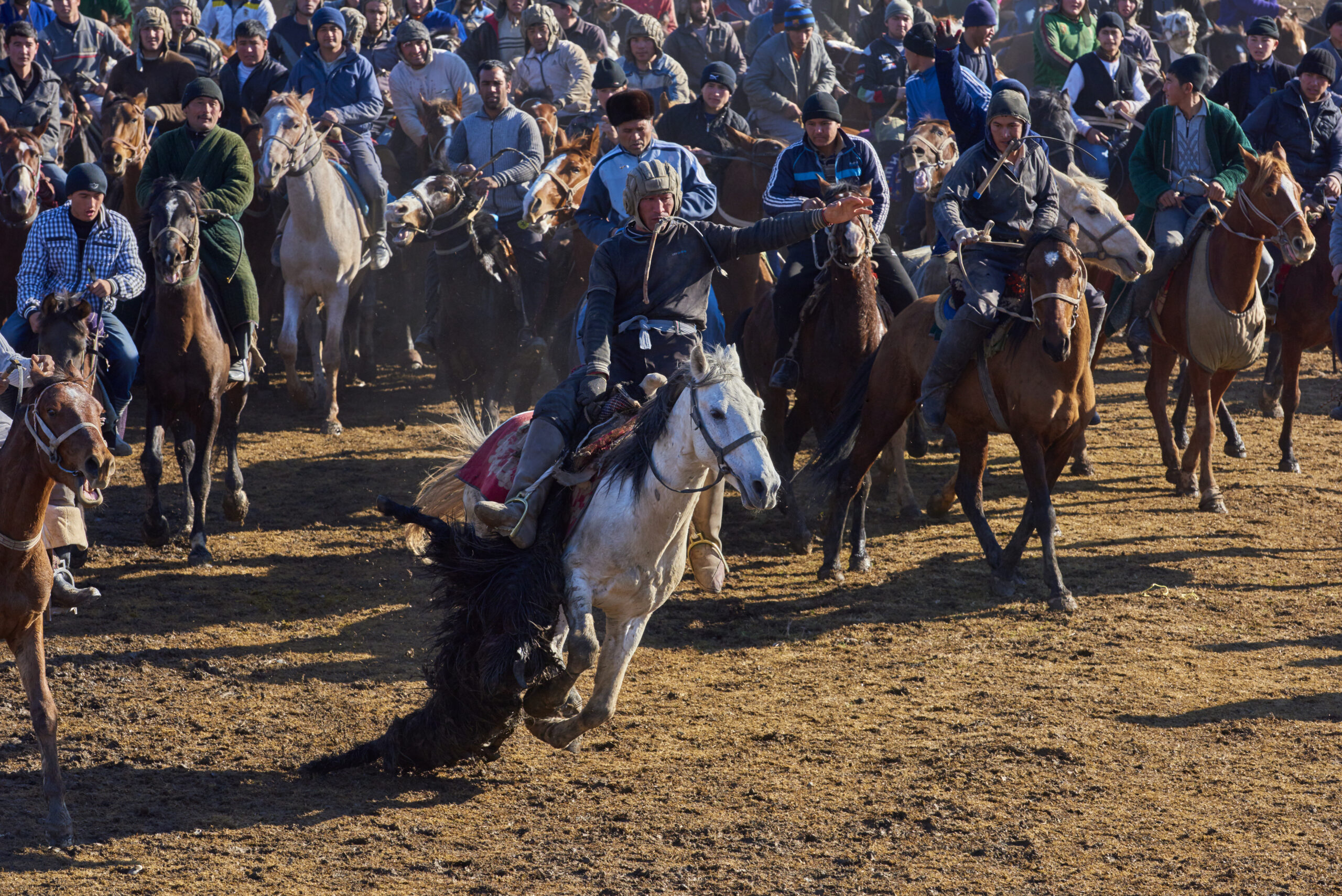 Uzbekistan, Kachka Daria province, Buzkashi game, horsemen fighting for a sheep body