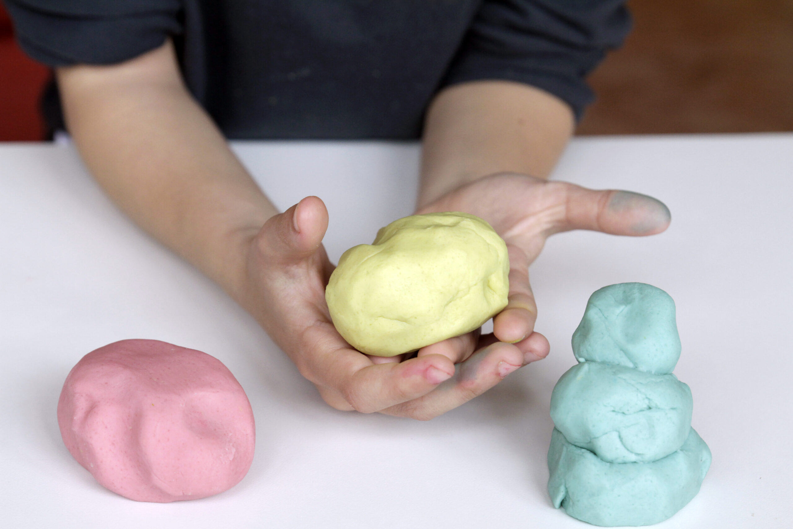 Child playing with play dough