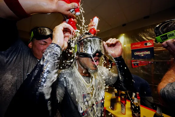 HOUSTON, TX - NOVEMBER 02:  Ozzie Albies #1 of the Atlanta Braves celebrates with teammates in the clubhouse after the Braves defeated the Houston Astros in Game 6 to clinch the 2021 World Series at Minute Maid Park on Tuesday, November 2, 2021 in Houston, Texas. (Photo by Daniel Shirey/MLB Photos via Getty Images)
