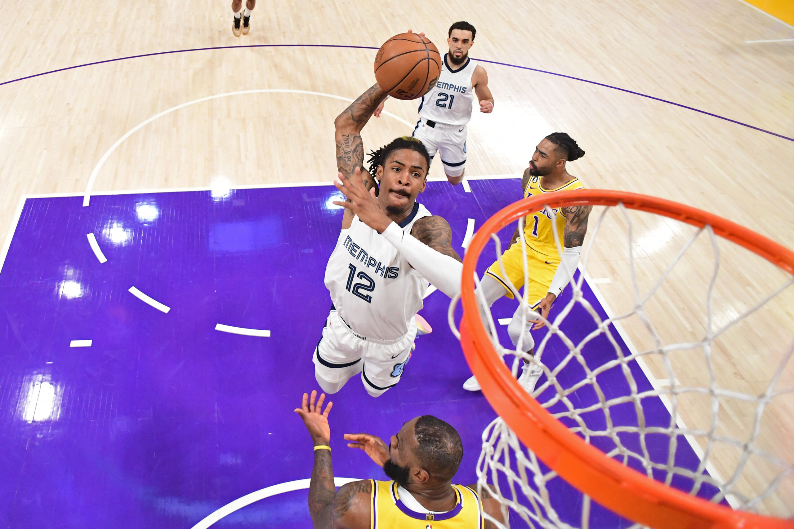 LOS ANGELES, CA - APRIL 28: Ja Morant #12 of the Memphis Grizzlies drives to the basket against the Los Angeles Lakers during round One Game Six of the 2023 NBA Playoffs on April 28, 2023 at Crypto.Com Arena in Los Angeles, California. NOTE TO USER: User expressly acknowledges and agrees that, by downloading and/or using this Photograph, user is consenting to the terms and conditions of the Getty Images License Agreement. Mandatory Copyright Notice: Copyright 2023 NBAE (Photo by Adam Pantozzi/NBAE via Getty Images)