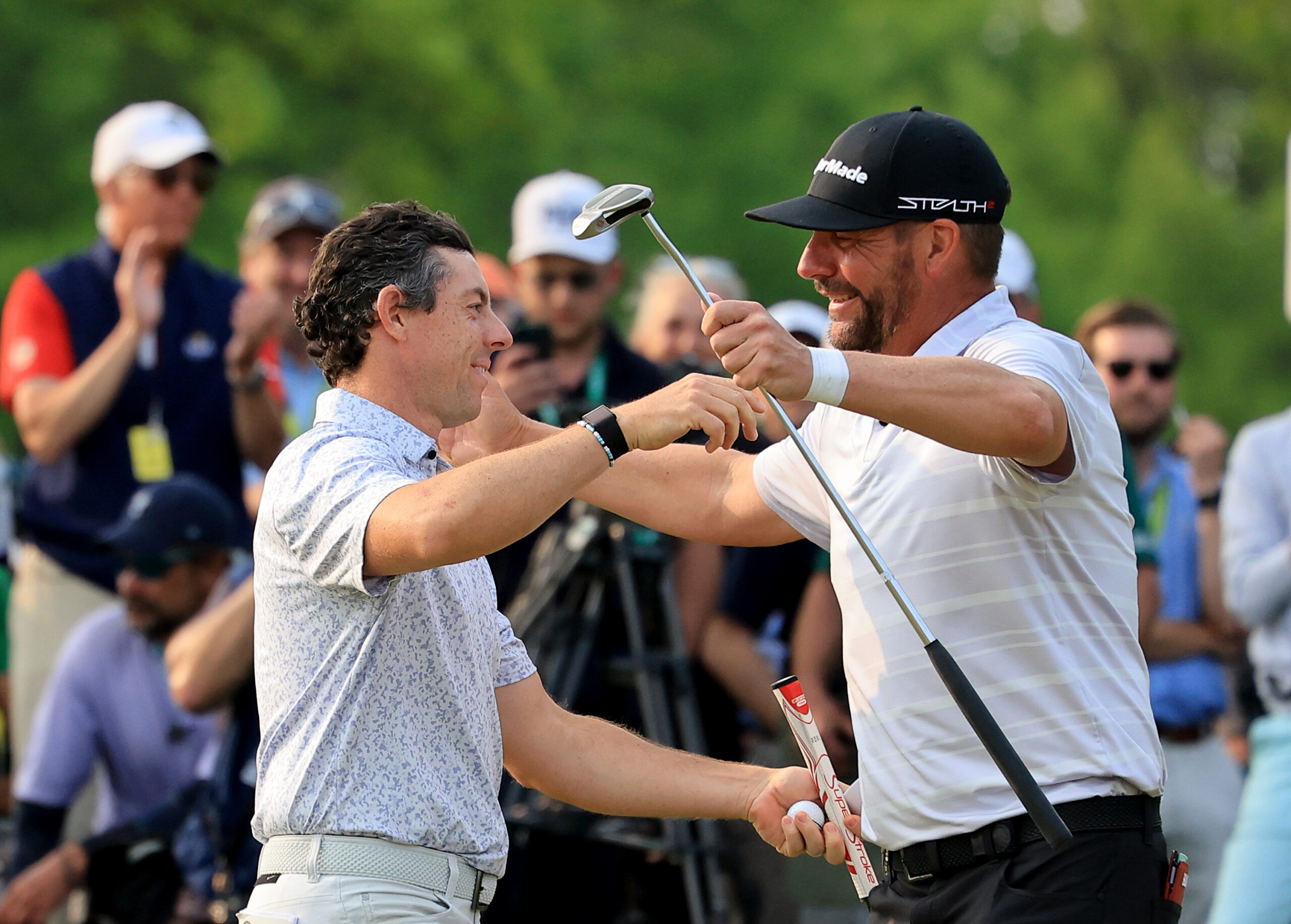 ROCHESTER, NEW YORK - MAY 21: Michael Block of The United States is congratulated by his playing partner Rory McIlroy of Northern Ireland on the 18th green after they had finished their rounds during the final round of the 2023 PGA Championship at Oak Hill Country Club on May 21, 2023 in Rochester, New York. (Photo by David Cannon/Getty Images)