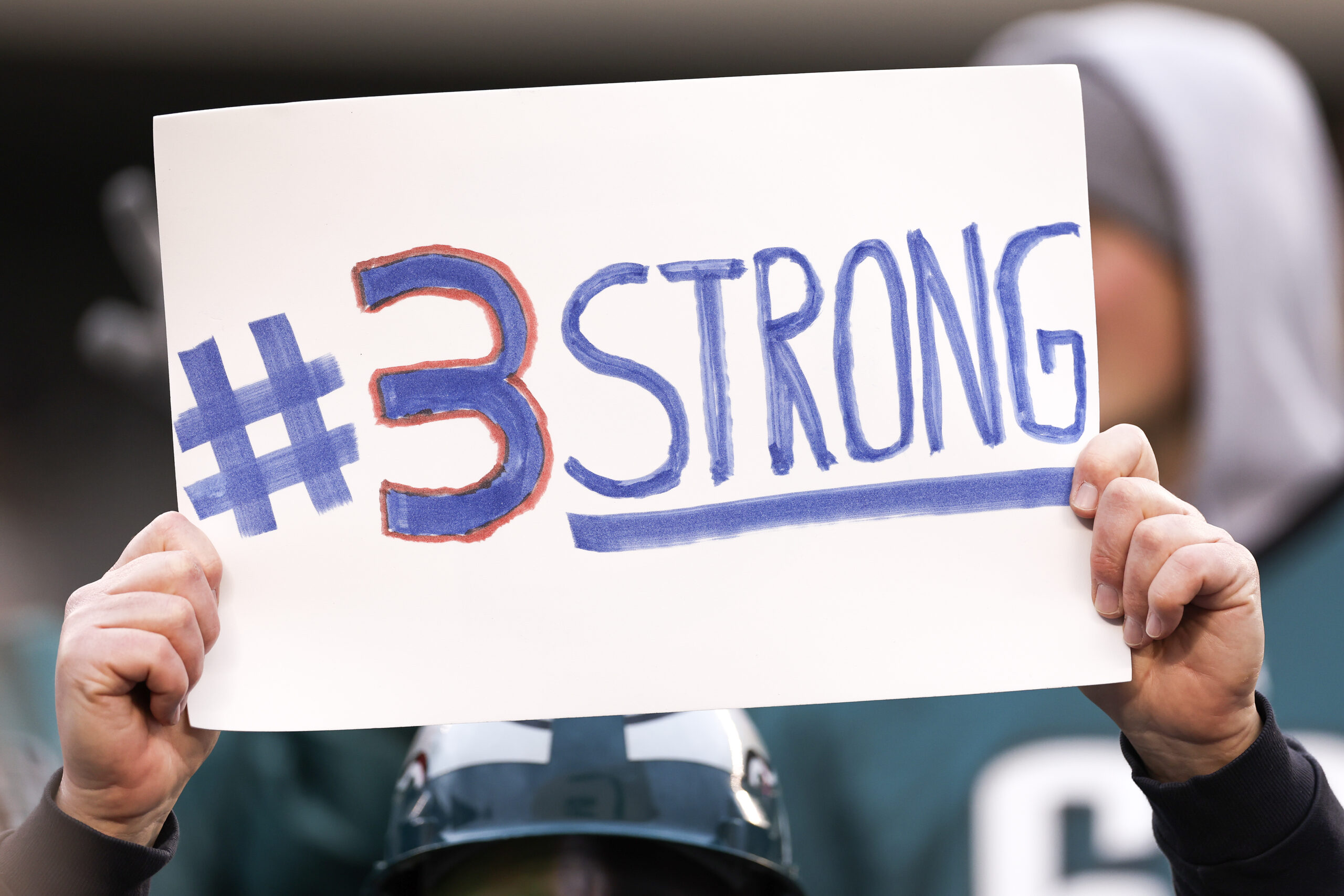 PHILADELPHIA, PENNSYLVANIA - JANUARY 08: A fan displays a sign for Damar Hamlin #3 of the Buffalo Bills during a game between the Philadelphia Eagles and the New York Giants at Lincoln Financial Field on January 08, 2023 in Philadelphia, Pennsylvania. (Photo by Tim Nwachukwu/Getty Images)