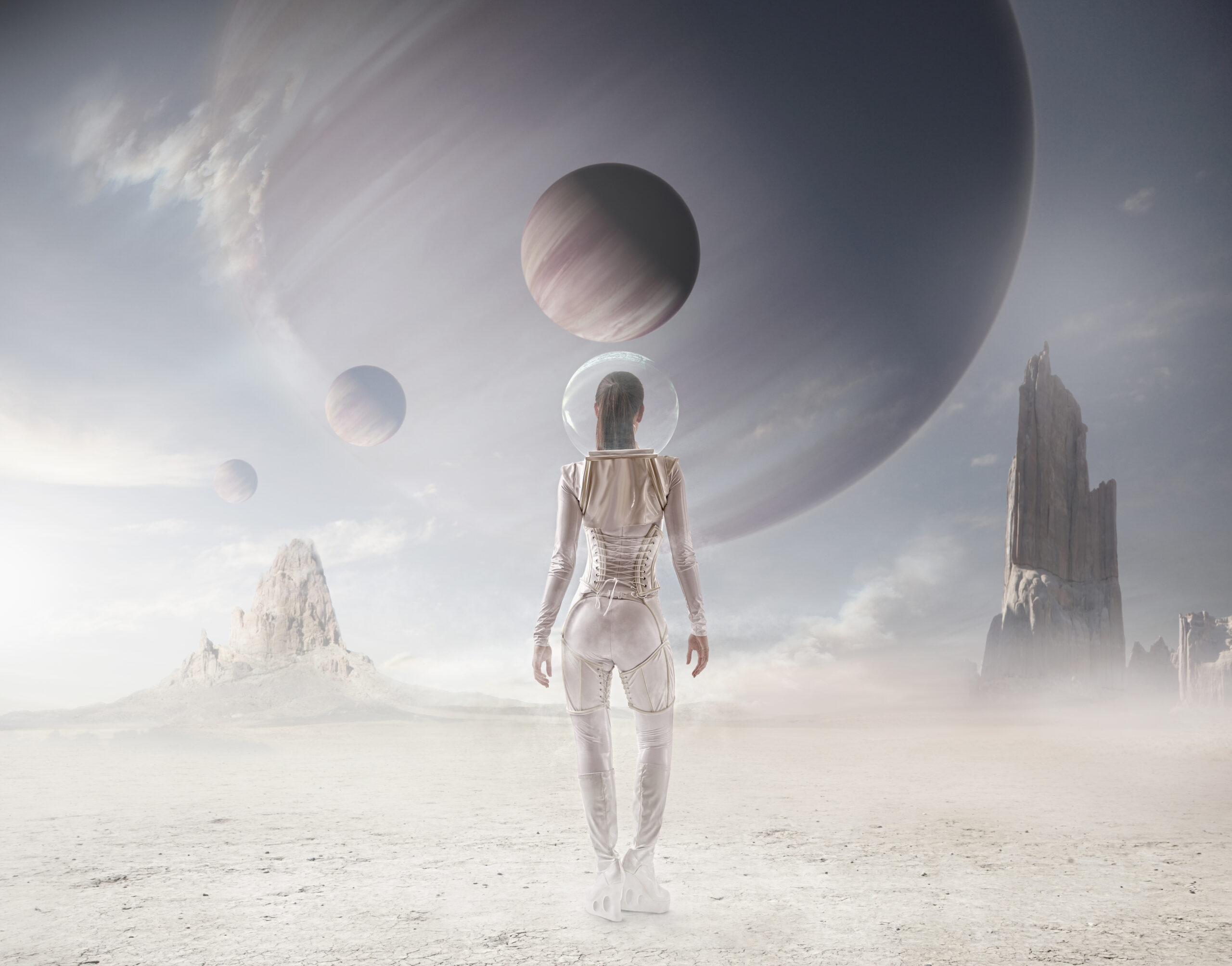 Futuristic Pacific Islander woman watching planets in sky