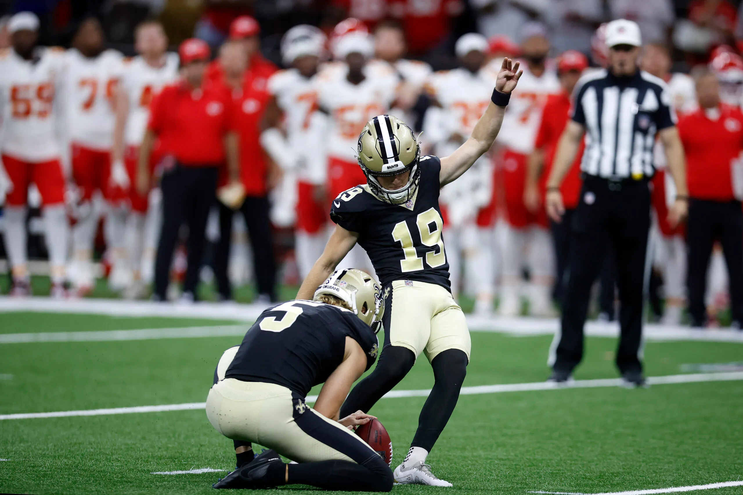 NEW ORLEANS, LOUISIANA - AUGUST 13: Blake Grupe #19 of the New Orleans Saints kicks a game-winning field goal during a preseason game against the Kansas City Chiefs at Caesars Superdome on August 13, 2023 in New Orleans, Louisiana. (Photo by Chris Graythen/Getty Images)