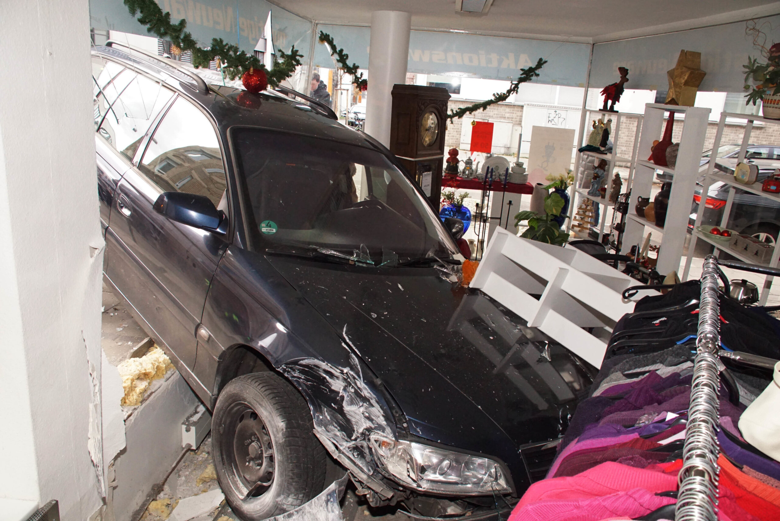A picture taken on December 26, 2017 shows the damage after a car ploughed through the window of a store in the Bad Cannstat district of Stuttgart.
The driver has lost the control of the vehicle for unknown reasons.  / AFP PHOTO / dpa / Andreas Rosar / Germany OUT        (Photo credit should read ANDREAS ROSAR/DPA/AFP via Getty Images)
