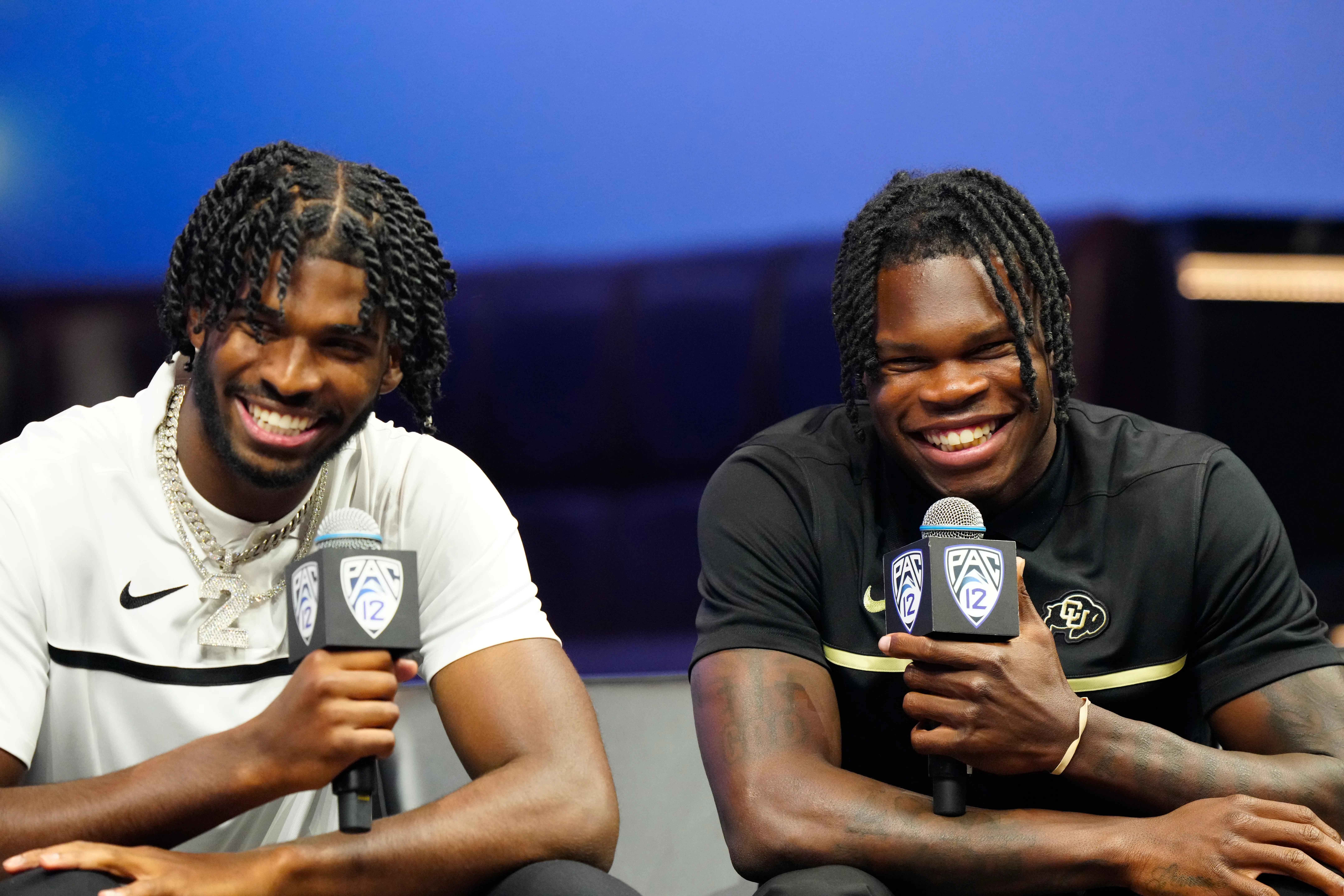 LAS VEGAS, NEVADA - JULY 21: (L-R) Shedeur Sanders #2 and Travis Hunter #12 of the University of Colorado Buffaloes speak with the media at Zouk Nightclub at Resorts World Las Vegas on July 21, 2023 in Las Vegas, Nevada. (Photo by Louis Grasse/Getty Images)