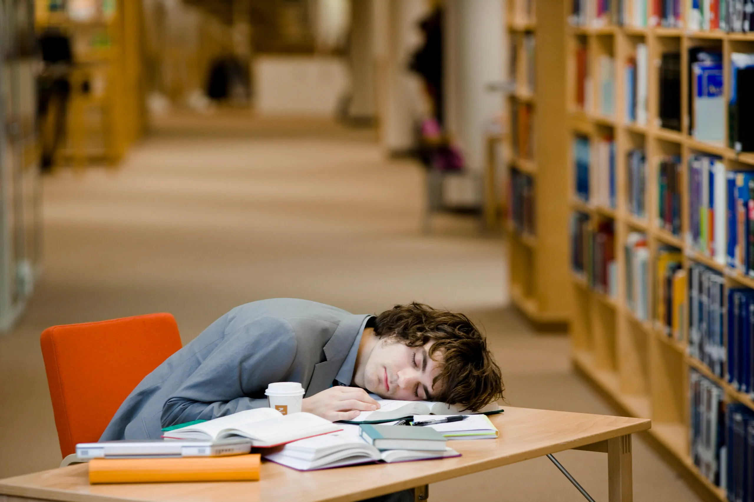A student who has fallen asleep in a library Sweden.